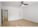Bright bedroom with a ceiling fan, wood-look floors, and white walls at 3649 Peachtree Ne Rd # 305, Atlanta, GA 30319