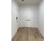 Welcoming entryway with modern floors, a double-door closet, and white trim at 3649 Peachtree Ne Rd # 305, Atlanta, GA 30319
