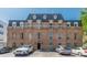 Classic brick building with multi-pane windows and architectural roof details at 3649 Peachtree Ne Rd # 305, Atlanta, GA 30319