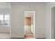 Bright hallway with hardwood floors and an open doorway leading to another room at 3649 Peachtree Ne Rd # 305, Atlanta, GA 30319