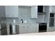 Updated kitchen with modern appliances and white cabinets at 3649 Peachtree Ne Rd # 305, Atlanta, GA 30319