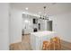 Modern kitchen with a large island, pendant lighting, and stainless steel appliances at 3649 Peachtree Ne Rd # 305, Atlanta, GA 30319