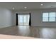 Bright living room with hardwood flooring and sliding glass doors at 3649 Peachtree Ne Rd # 305, Atlanta, GA 30319