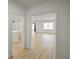 Open concept living space featuring light colored wood floors and white walls at 3649 Peachtree Ne Rd # 305, Atlanta, GA 30319