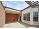Unique outdoor patio with brick wall, painted art, and string lights at 3649 Peachtree Ne Rd # 305, Atlanta, GA 30319