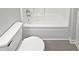 Clean bathroom showcasing a white tub and toilet at 6795 Browns Mill Walk, Lithonia, GA 30038