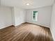 Cozy bedroom includes wood-look flooring and closet at 6795 Browns Mill Walk, Lithonia, GA 30038
