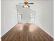 Vaulted ceiling bedroom with wood-look flooring and ample natural light at 6795 Browns Mill Walk, Lithonia, GA 30038