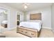 Bedroom featuring a large bed, mirrored closets, and a ceiling fan at 1090 Crown River Pkwy, Mcdonough, GA 30252