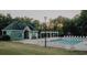 Inviting community pool with ample lounge chairs and a clubhouse nearby at 1090 Crown River Pkwy, Mcdonough, GA 30252