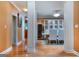 Spacious dining room with hardwood floors, wine cooler, and seating for six at 1090 Crown River Pkwy, Mcdonough, GA 30252