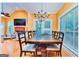 Open concept dining room with large windows and access to the backyard at 1090 Crown River Pkwy, Mcdonough, GA 30252