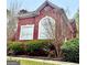 Charming brick home featuring large windows and lush landscaping at 1090 Crown River Pkwy, Mcdonough, GA 30252
