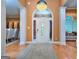 Stately foyer with hardwood floors, decorative chandelier, and elegant architectural details at 1090 Crown River Pkwy, Mcdonough, GA 30252