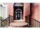 Elegant brick entrance with a charming front door and manicured landscaping at 1090 Crown River Pkwy, Mcdonough, GA 30252