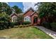 Attractive brick home with lush landscaping and a welcoming front entrance at 1090 Crown River Pkwy, Mcdonough, GA 30252