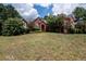 Attractive brick home with lush landscaping and a welcoming front entrance at 1090 Crown River Pkwy, Mcdonough, GA 30252