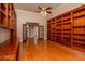 Large office with hardwood floors and built-in shelves and cabinets at 1090 Crown River Pkwy, Mcdonough, GA 30252