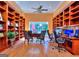 This office or study has built-in bookshelves, hardwood floors and a ceiling fan at 1090 Crown River Pkwy, Mcdonough, GA 30252