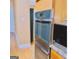 Stainless steel double oven with sleek design, enhancing the kitchen's modern feel at 1090 Crown River Pkwy, Mcdonough, GA 30252