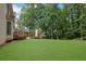 The backyard features a grassy lawn at 1952 Skidmore Cir, Lawrenceville, GA 30044