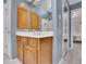 A bathroom features a wooden vanity with a sink at 1952 Skidmore Cir, Lawrenceville, GA 30044
