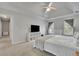 A bedroom features a large bed and windows for natural light at 1952 Skidmore Cir, Lawrenceville, GA 30044
