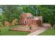 Stately two-story brick home with a well-manicured front yard and mature trees at 1952 Skidmore Cir, Lawrenceville, GA 30044
