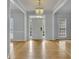 A view of the foyer showcasing an elegant chandelier at 1952 Skidmore Cir, Lawrenceville, GA 30044
