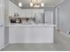 Spacious kitchen featuring white cabinets, an island, and stainless steel appliances at 1952 Skidmore Cir, Lawrenceville, GA 30044