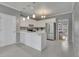 Bright kitchen with a central island, white cabinets, and stainless steel appliances at 1952 Skidmore Cir, Lawrenceville, GA 30044