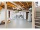 Unfinished basement with painted concrete floor offers plenty of potential for customization at 2093 Kolb Ridge Sw Ct, Marietta, GA 30008