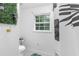Contemporary bathroom showing toilet area with stylish black and white shower curtain and botanical accents at 2093 Kolb Ridge Sw Ct, Marietta, GA 30008
