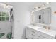 Modern bathroom features a double vanity, stylish fixtures, and an adjacent toilet room with a garden window at 2093 Kolb Ridge Sw Ct, Marietta, GA 30008
