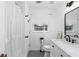 Well-lit bathroom featuring stylish fixtures, a shower with curtain, and neutral color scheme at 2093 Kolb Ridge Sw Ct, Marietta, GA 30008