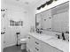 Elegant bathroom featuring a double sink vanity with marble countertops and modern fixtures at 2093 Kolb Ridge Sw Ct, Marietta, GA 30008