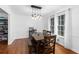Elegant dining room featuring wood floors, a chandelier, and natural light at 2093 Kolb Ridge Sw Ct, Marietta, GA 30008