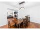 Comfortable dining room with a wooden table, decorative chandelier, and connection to the living room at 2093 Kolb Ridge Sw Ct, Marietta, GA 30008