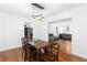 Open dining space featuring a wooden table, chandelier, and a seamless flow to the living area at 2093 Kolb Ridge Sw Ct, Marietta, GA 30008