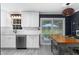 Bright kitchen with white cabinets, stainless appliances, and island with backyard views at 2093 Kolb Ridge Sw Ct, Marietta, GA 30008