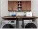 Convenient laundry room featuring a folding table and overhead cabinets for optimal organization at 2093 Kolb Ridge Sw Ct, Marietta, GA 30008