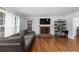 Inviting living room boasts a decorative fireplace and hardwood floors for a warm atmosphere at 2093 Kolb Ridge Sw Ct, Marietta, GA 30008