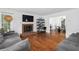 Bright living room features hardwood floors, brick fireplace, and ample seating, perfect for gatherings at 2093 Kolb Ridge Sw Ct, Marietta, GA 30008