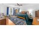 Bright main bedroom featuring a ceiling fan, an ensuite bathroom, hardwood floors, and plenty of space at 2093 Kolb Ridge Sw Ct, Marietta, GA 30008