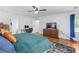 Well-lit main bedroom with hardwood floors, work space and walk in closet at 2093 Kolb Ridge Sw Ct, Marietta, GA 30008