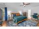 Spacious main bedroom features hardwood floors, ceiling fan, ensuite bathroom, and generous closet space at 2093 Kolb Ridge Sw Ct, Marietta, GA 30008