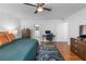 Well-lit main bedroom featuring a ceiling fan, ensuite bathroom, and work space at 2093 Kolb Ridge Sw Ct, Marietta, GA 30008