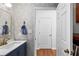 Charming powder room featuring stylish wallpaper, modern fixtures, and easy access to the laundry room at 2093 Kolb Ridge Sw Ct, Marietta, GA 30008