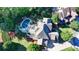 Aerial view of a large house with a pool and patio in a well manicured yard with lush landscaping at 2996 Walkin Horse Trl, Buford, GA 30519
