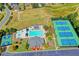 Birds-eye view of tennis courts, a basketball court, and an aquatic center in the community at 2996 Walkin Horse Trl, Buford, GA 30519